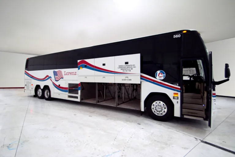 Lorenz Bus Service motorcoach with undercarriage storage bays open, showing luggage compartment capacity