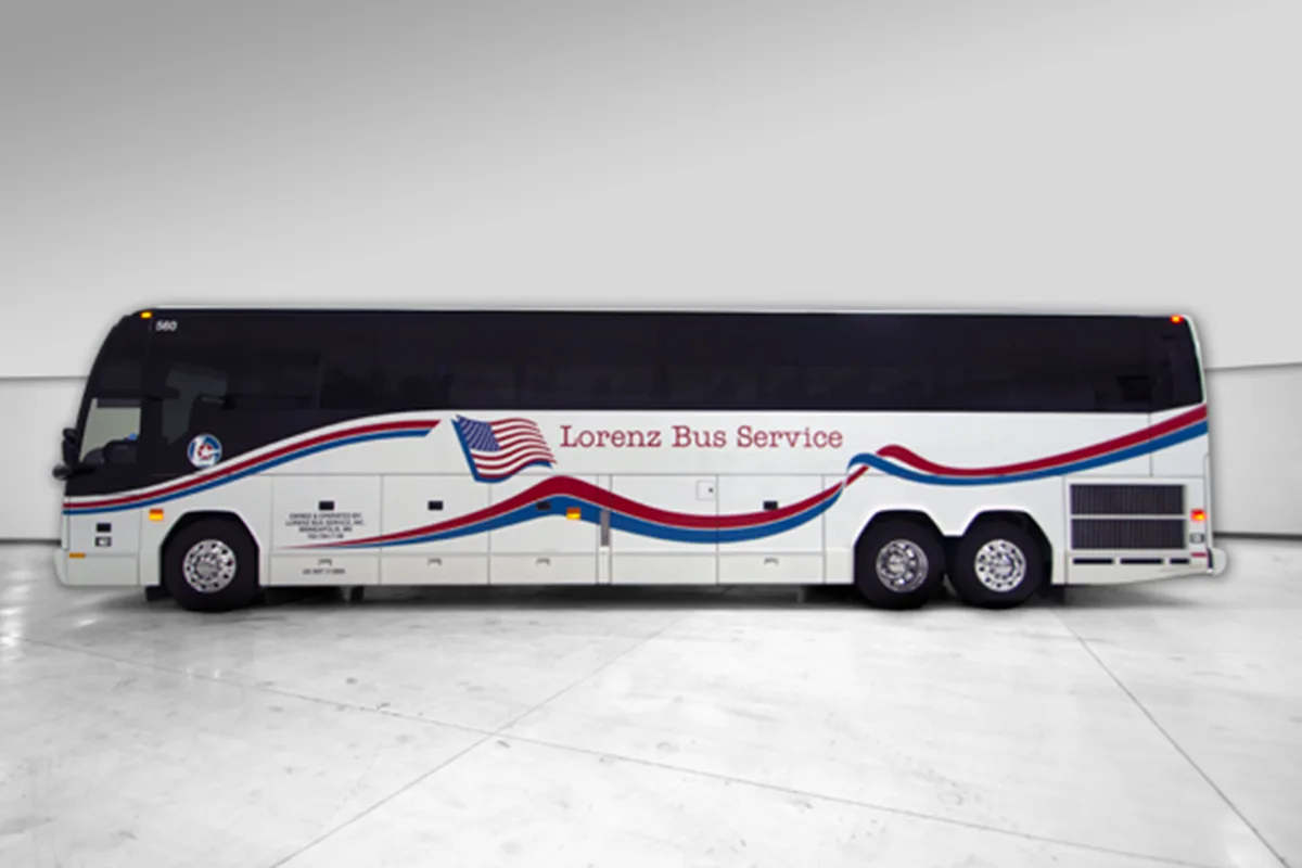 Lorenz Bus Service full-size motorcoach with red, white, and blue livery and American flag graphic