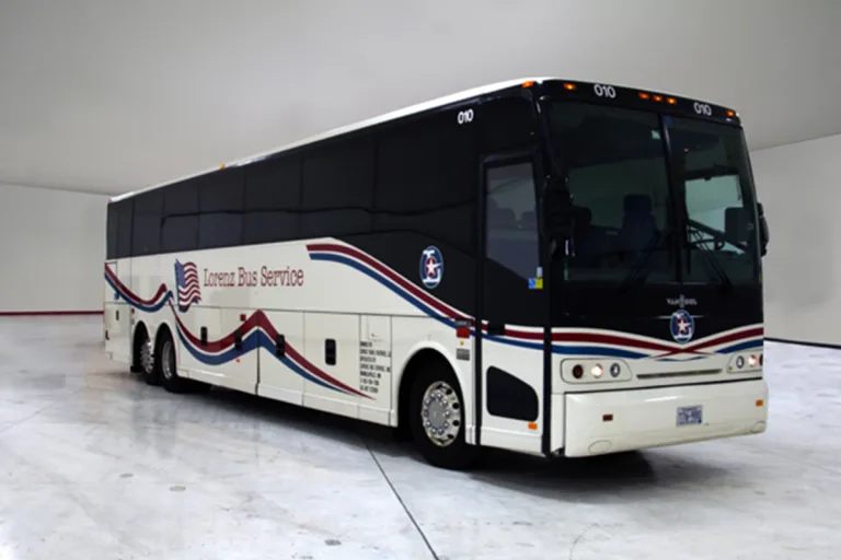 Lorenz Bus Service full-size motorcoach with red, white, and blue wave graphics and American flag logo on the side