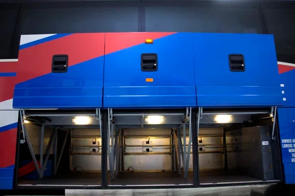 Lorenz Bus Service motorcoach open luggage storage bays with interior lighting, side view