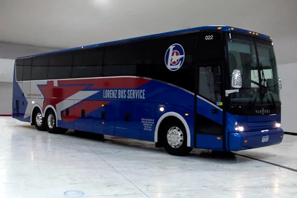 Blue Lorenz Bus Service motorcoach exterior, rear three-quarter view parked indoors