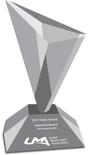 Crystal 2023 Vision Award trophy from United Motorcoach Association presented to Lorenz Bus Service of Minneapolis