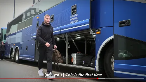 NFL player loading luggage into the bay of a Lorenz Bus Service motorcoach in a screenshot from the Netflix series Quarterback