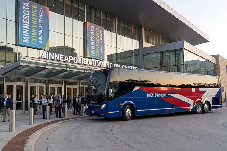 Lorenz Bus Service charter coach parked outside the Minneapolis Convention Center during a Minnesota Conference Annual Assembly event