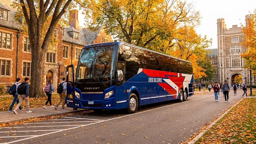 Lorenz Bus Service Prevost motorcoach parked on a university campus in autumn as students board and walk nearby