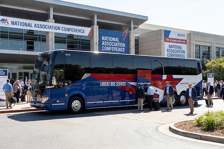 Lorenz Bus Service motorcoach parked outside a National Association Conference center as attendees board