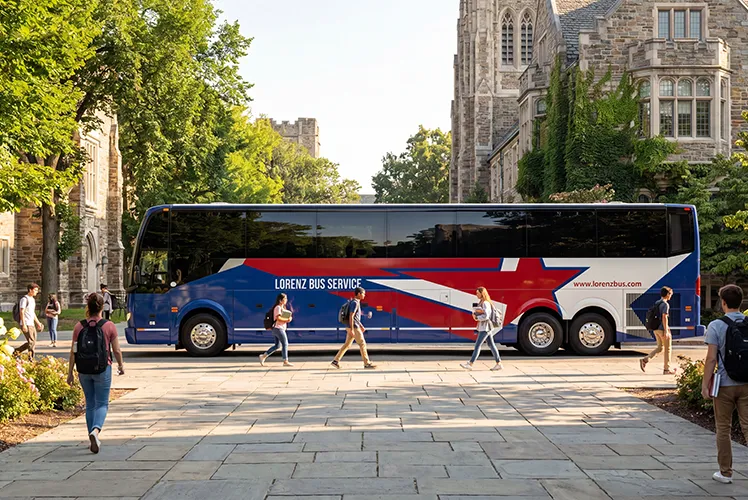 Lorenz Bus Service motorcoach parked on a university campus with students walking past stone academic buildings